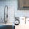 Kitchen with subway tiling and stainless steel appliances