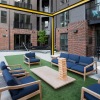 open and spacious rooftop terrace with patio furniture and games
